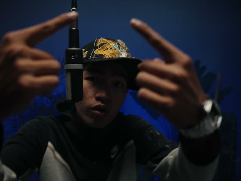 YXNGTABI performing under the hanging mic